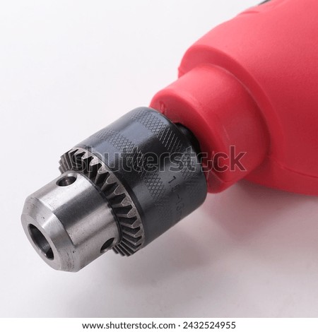 Electric tools power drill machines and white background, Electric drill tools set,  Picture of a green jig sawand a drill on a wooden background
