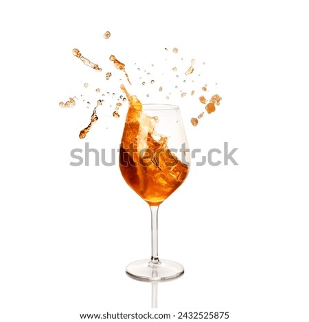 Aperol Spritz, the classic Italian aperitif with Prosecco, in a wine glass with ice and a vibrant orange splash. Royalty-Free Stock Photo #2432525875