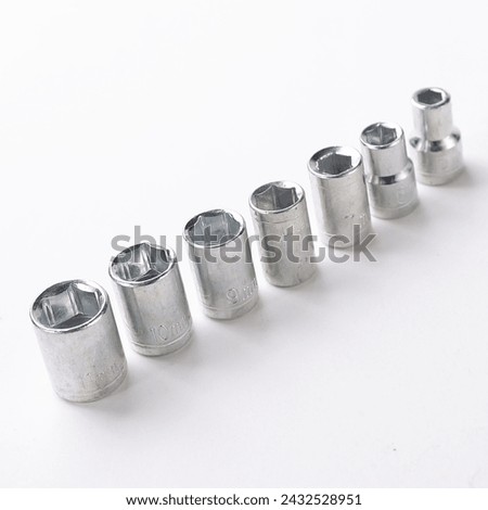 Closeup shot of various Torx bits stored neatly in a tool box, a fully stocked ratchet box with various bits and nuts, set of socket wrench and screw drivers in plastic box closeup
 Royalty-Free Stock Photo #2432528951