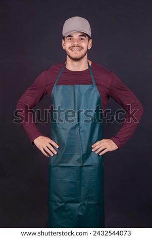 people, profession and work concept - happy smiling farmer or gardener in apron