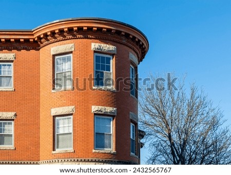 Rounded corner design of an old building on a winter sunny day in Boston, MA, USA