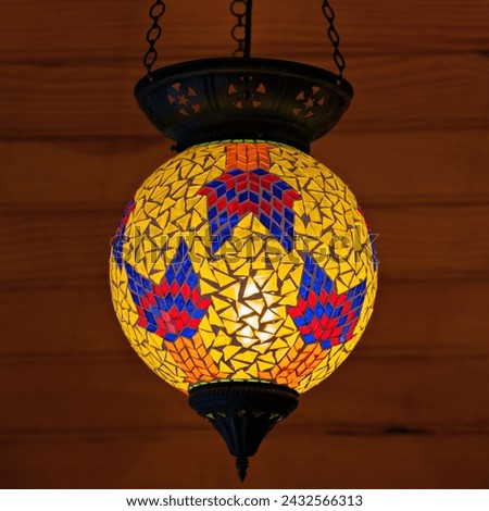 a colorful mosaic lamp from a ceiling