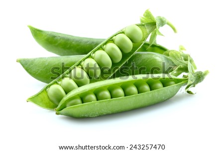 Green peas in closeup Royalty-Free Stock Photo #243257470