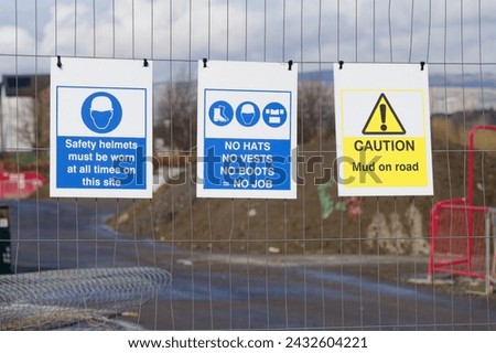 Construction site health and safety message rules sign board signage on fence