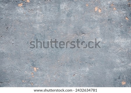 Faded blue weathered old house plastered wall closeup as grunge background