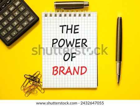The power of brand symbol. Concept words The power of brand on beautiful white note. Beautiful yellow background. Calculator. Black pen. Business the power of brand concept. Copy space.