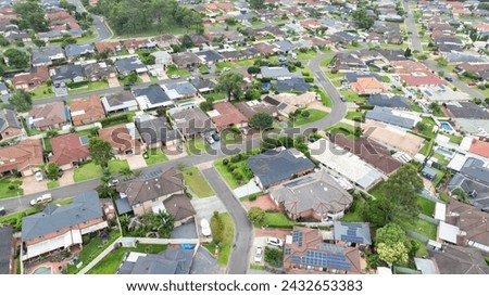 Drone aerial photograph of residential houses and surroundings in the greater Sydney suburb of Glenmore Park in New South Wales in Australia Royalty-Free Stock Photo #2432653383