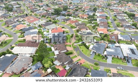Drone aerial photograph of residential houses and surroundings in the greater Sydney suburb of Glenmore Park in New South Wales in Australia Royalty-Free Stock Photo #2432653393
