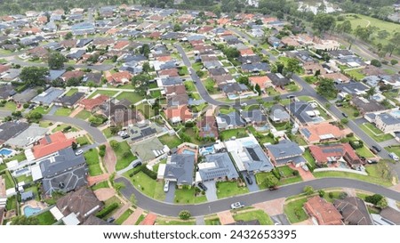 Drone aerial photograph of residential houses and surroundings in the greater Sydney suburb of Glenmore Park in New South Wales in Australia Royalty-Free Stock Photo #2432653395