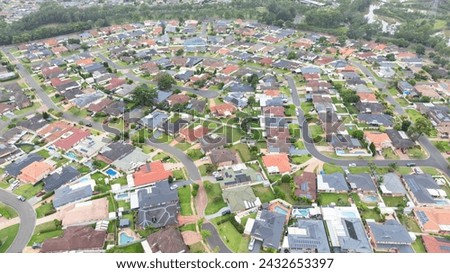 Drone aerial photograph of residential houses and surroundings in the greater Sydney suburb of Glenmore Park in New South Wales in Australia Royalty-Free Stock Photo #2432653397