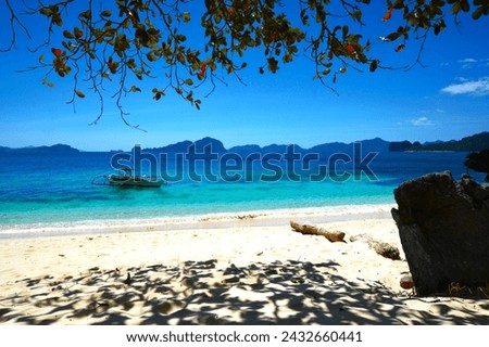 Tropical paradise - sunny day on a sandy beach (El Nido, Palawan, Philippines) Royalty-Free Stock Photo #2432660441