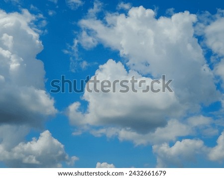 This is a beautiful high-resolution stock photo of a blue sky background with fluffy white clouds. It is perfect for use as a weather forecast background or as a nature backdrop for any project.