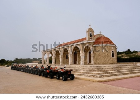 Ayios Epiphanios, greek church in Ayia napa with a row of quads in front Royalty-Free Stock Photo #2432680385