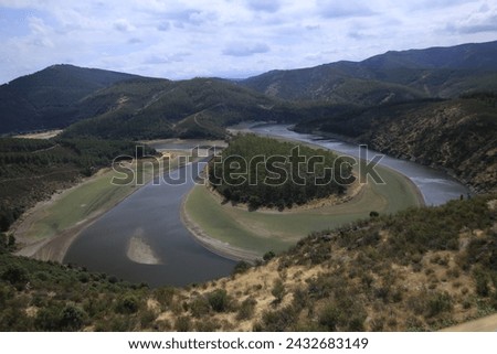 The Meandro del Melero is a natural area of extreme beauty, in a particular enclave that separates Las Hurdes from the province of Salamanca. Royalty-Free Stock Photo #2432683149