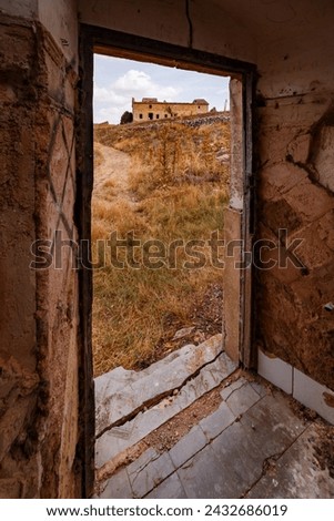 Entrance door with house in the background