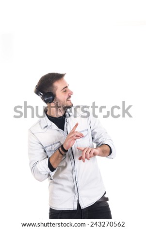 Portrait of a handsome young man listening to music with headphones