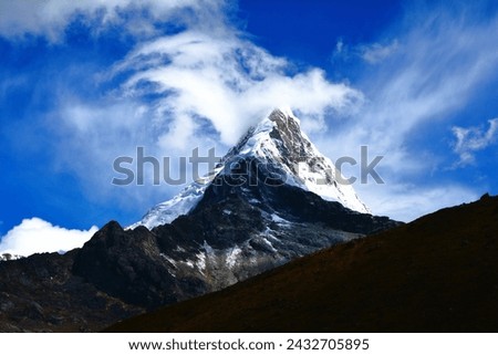 Artesonraju (6025 m) - a pyramidal mountain peak located near the city of Caraz in the Cordillera Blanca mountain range in the Peruvian Andes (Huascaran National Park, Peru)