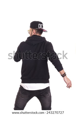 Back of guy dancing wearing hoodie and black cap Royalty-Free Stock Photo #243270727