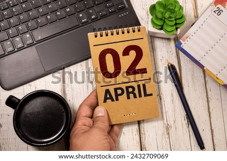 2 April on wooden grey cubes. Calendar cube date 02 April. Concept of date. Copy space for text or event. Educational cubes. Wood blocks in box with date, day and month. Selective focus Royalty-Free Stock Photo #2432709069