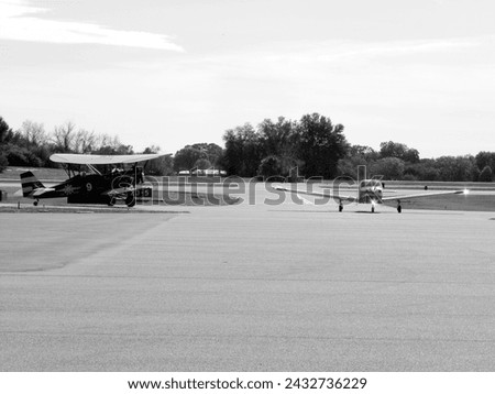 A black and white photo of an unknown type of Biplane at Winter Haven airport in Winter Haven, Florida during early 2017. 