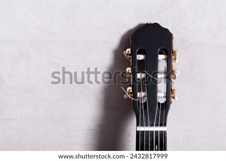 A photo of Acoustic headstock guitar Royalty-Free Stock Photo #2432817999