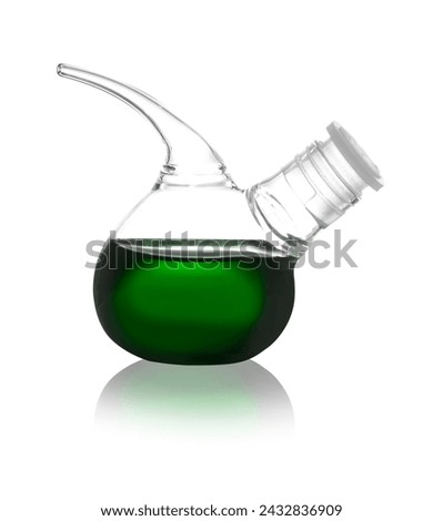 Retort flask with green liquid isolated on white. Laboratory glassware
