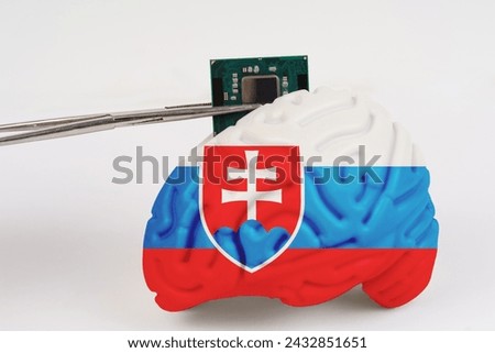 On a white background, a model of the brain with a picture of a flag - Slovakia, a microcircuit, a processor, is implanted into it. Close-up