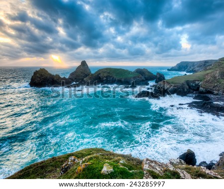 Stormy winters sunset at Kynance Cove on the coast of Cornwall England UK Europe