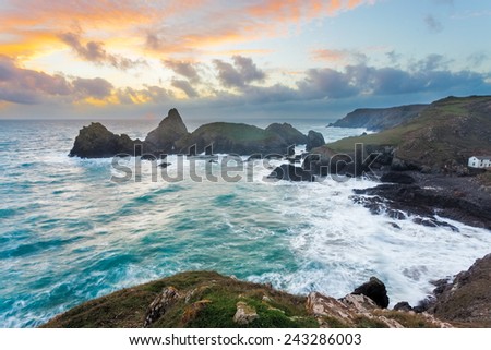 Stormy winters sunset at Kynance Cove on the coast of Cornwall England UK Europe