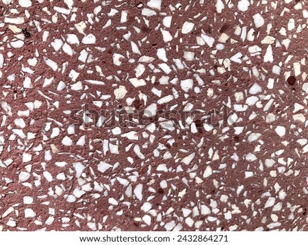 the texture of red and white ceramic shards