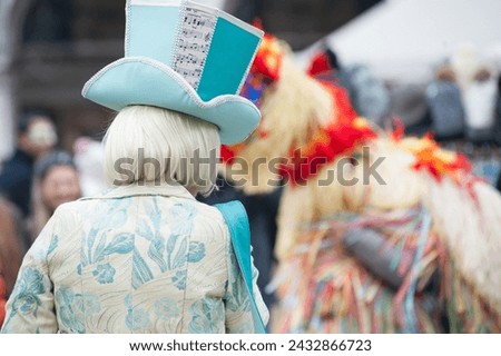 Close up of carnival mask with white green light blue color tone decorated with blurred background