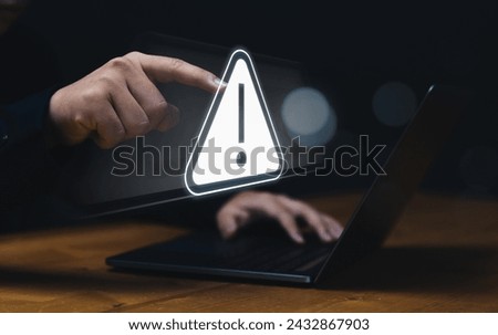 Programmer developer, staff businessman using computer laptop programming access security caution alert warning triangle sign, issued ungranted access online internet cybercrime.