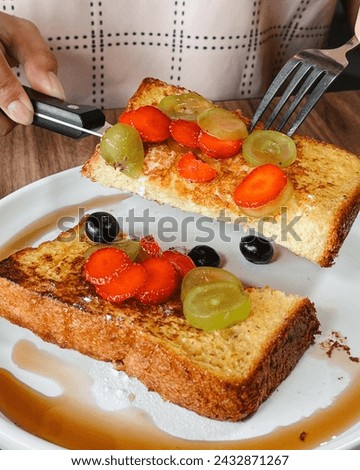 Sliced Toast Loaf White Bread (Shokupan or Roti Tawar) for Breakfast on Wooden Background, Served with Egg and Milk. Bakery Concept Picture
