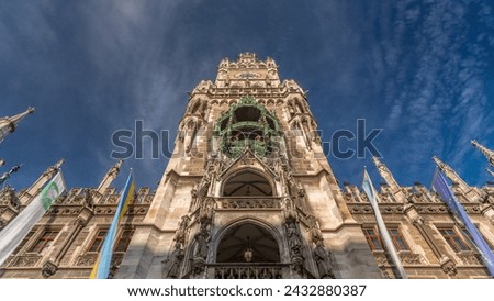 Clock Tower or Glockenspiel close-up, section of bell play timelapse, Munich, Germany. Looking up perspective. Detail of Rathaus New Town Hall with chime in city center. Located on Marienplatz square Royalty-Free Stock Photo #2432880387
