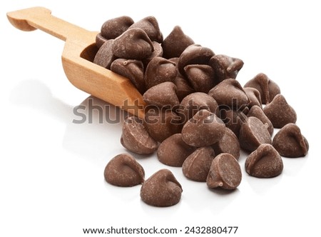 Chocolate chips in a serving scoop. Isolated on a white background.