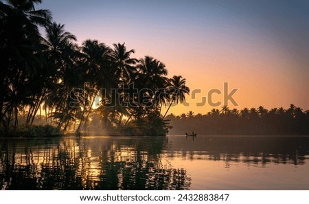 Beautiful nature landscape scenery from Gods own country, Magical morning sunrise lake view from Kavvayi island Kannur, Kerala  travel and tourism concept photography Royalty-Free Stock Photo #2432883847