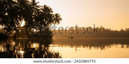 Panoramic view of morning lake with fishing boat, Magical sunrise scenery from Kannur Kavvayi Island, Kerala tourism photo Royalty-Free Stock Photo #2432885755