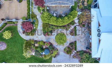 Aerial View of Lush Residential Garden with Stone Patio and Gazebo Royalty-Free Stock Photo #2432893289