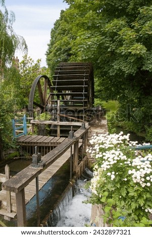 Paddlewheel on the banks of the Veules, France's smallest river, approx. 1km long Royalty-Free Stock Photo #2432897321