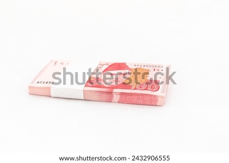 Pakistan one hundred rupees banknote bundle on white isolated background Royalty-Free Stock Photo #2432906555
