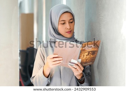 Nerdy islamic girl enjoying her time at the library. Nerdy  Smart girl at library concept
