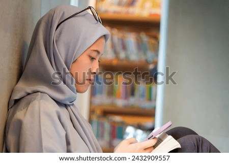 Nerdy islamic girl enjoying her time at the library. Nerdy  Smart girl at library concept