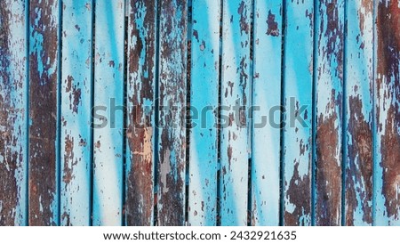 Aged Patina on Weathered Blue Wooden Boards. The Rustic Charm of Faded Paint and Time-Worn Wood. Outdoor Royalty-Free Stock Photo #2432921635