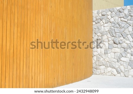 Wooden text background and stone wall with blue sky,Teak wood texture for background, wood texture with natural patterns,wall background concept.