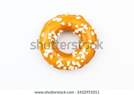 Sweet strawberry glazed donuts with sprinkles on white background, Delicious colorful donuts isolated on white background With clipping path.
