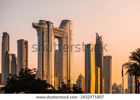 Dubai downtown skyline with modern skyscrapers at sunset. Dubai, United Arab Emirates. Famous travel destination Royalty-Free Stock Photo #2432971807