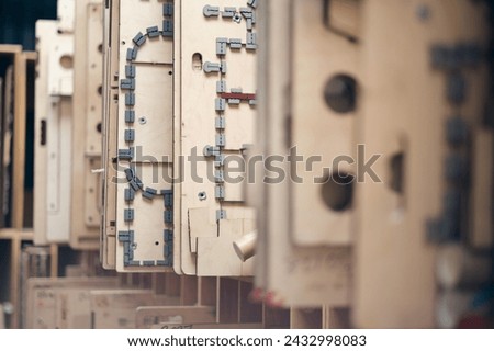 Wooden Flat and Rotary Die Ejection Rubber Installation Rotary Cutting Dies,. Wooden templates for rotary cylinder die ejection. Royalty-Free Stock Photo #2432998083