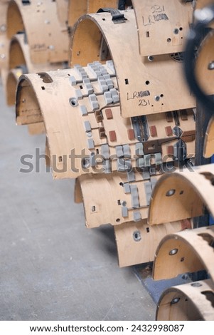 Wooden Flat and Rotary Die Ejection Rubber Installation Rotary Cutting Dies,. Wooden templates for rotary cylinder die ejection. Royalty-Free Stock Photo #2432998087