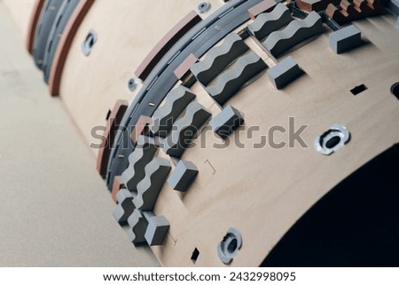 Wooden Flat and Rotary Die Ejection Rubber Installation Rotary Cutting Dies,. Wooden templates for rotary cylinder die ejection. Royalty-Free Stock Photo #2432998095