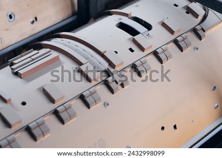 Wooden Flat and Rotary Die Ejection Rubber Installation Rotary Cutting Dies,. Wooden templates for rotary cylinder die ejection. Royalty-Free Stock Photo #2432998099